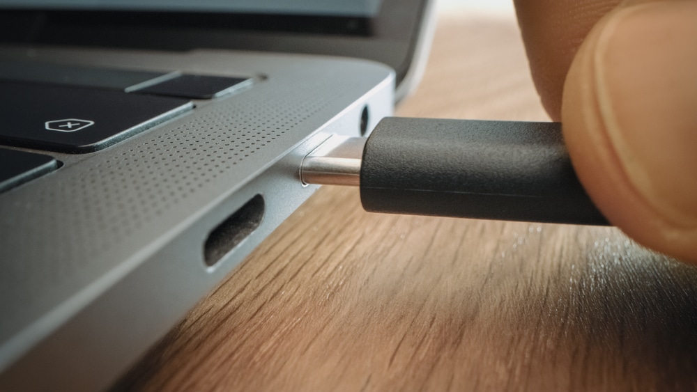 A close view of the charging port of a laptop