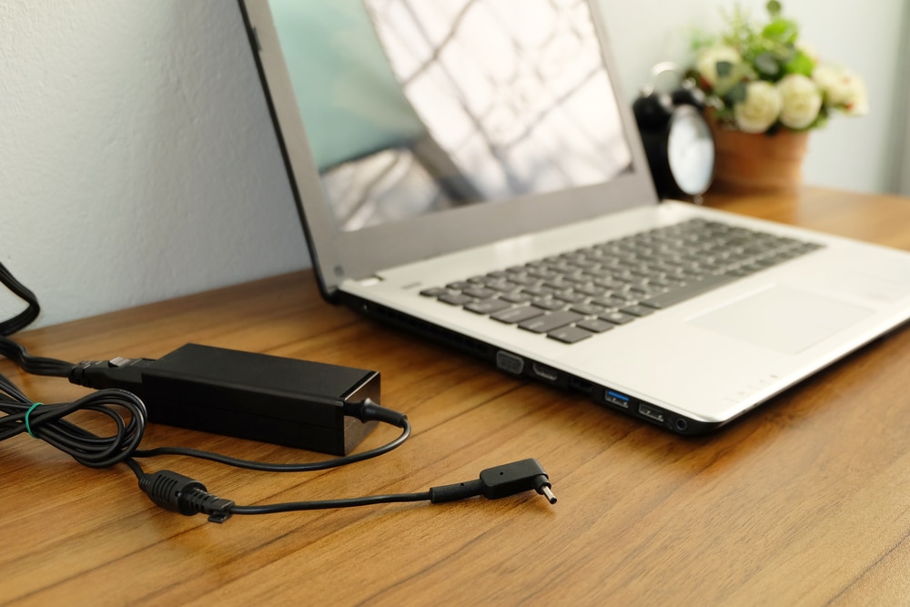 A view of a laptop alongside a charger