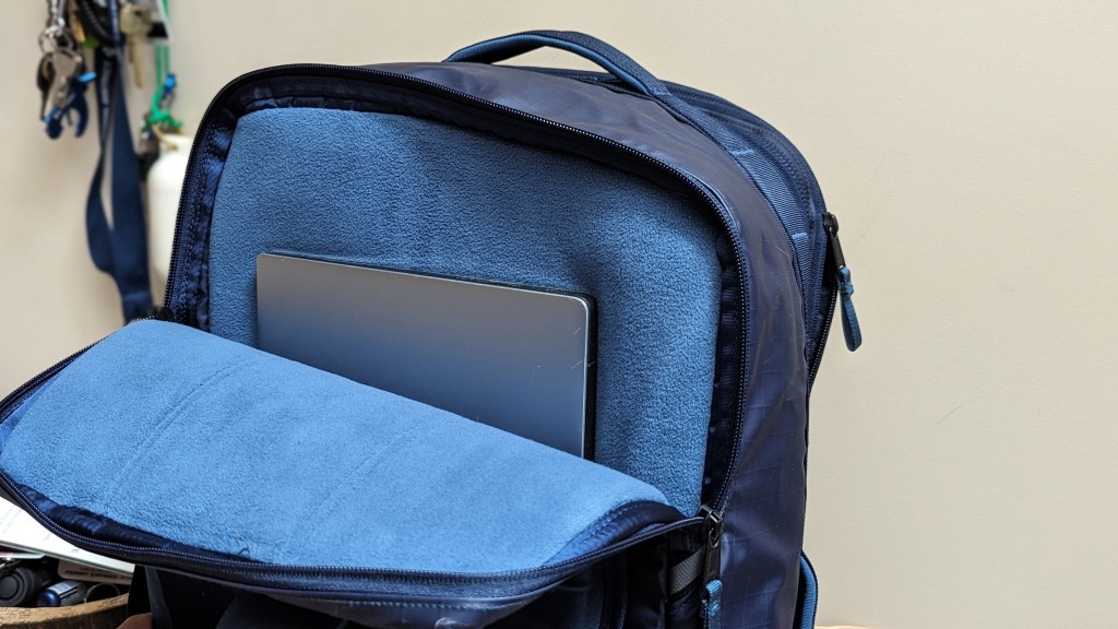 A bag with opened zip carrying a laptop inside