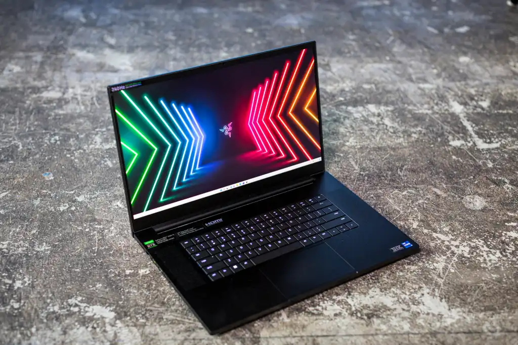 A laptop opened with neon graphics