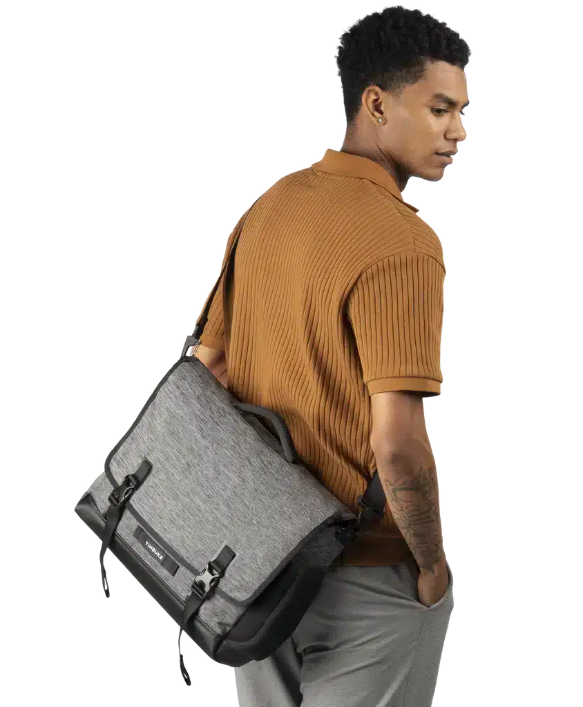 A side view of a person carrying the Timbuktu Closer Laptop Messenger Bag 