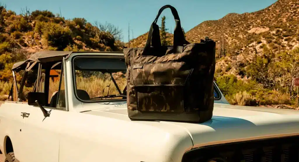 A view of Mission Workshop Drift Tote Bag on a car outdoors