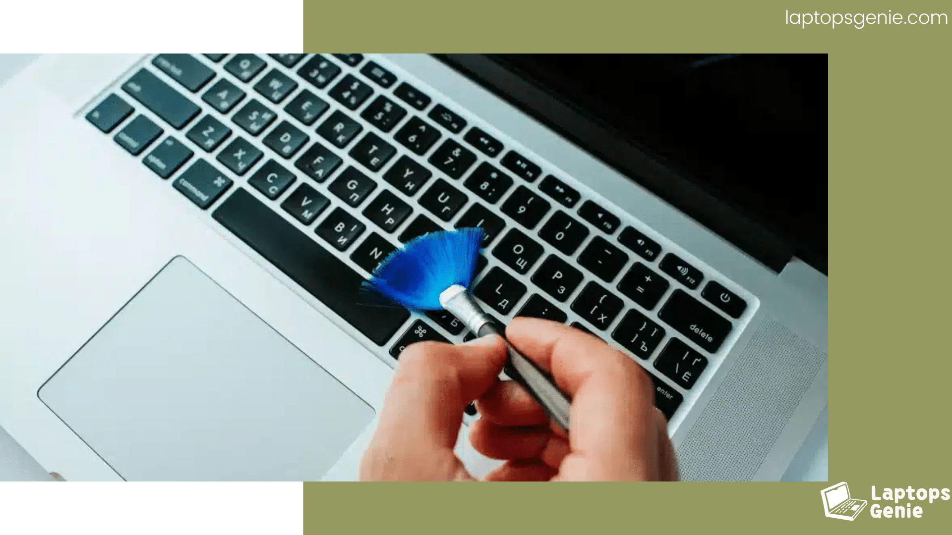 a person cleaning laptop keyboard