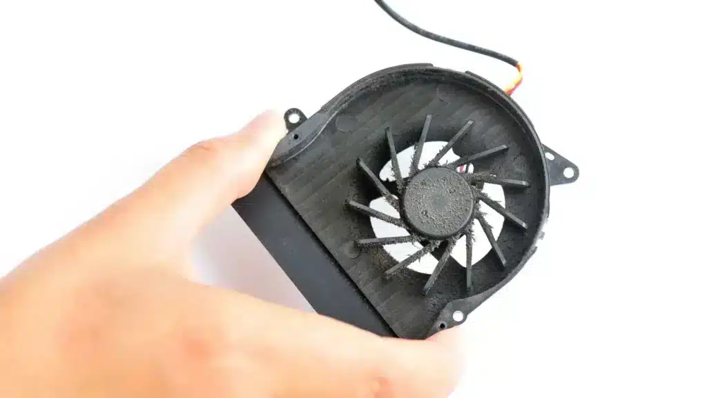 A view of a person holding a laptop fan