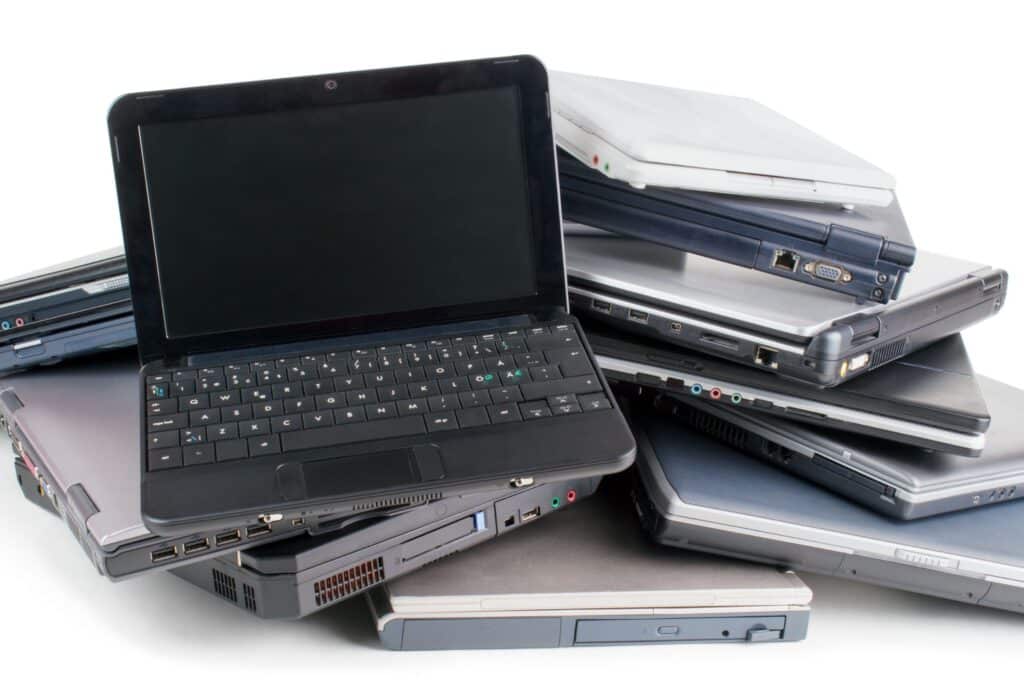 A view of a pile of old laptops