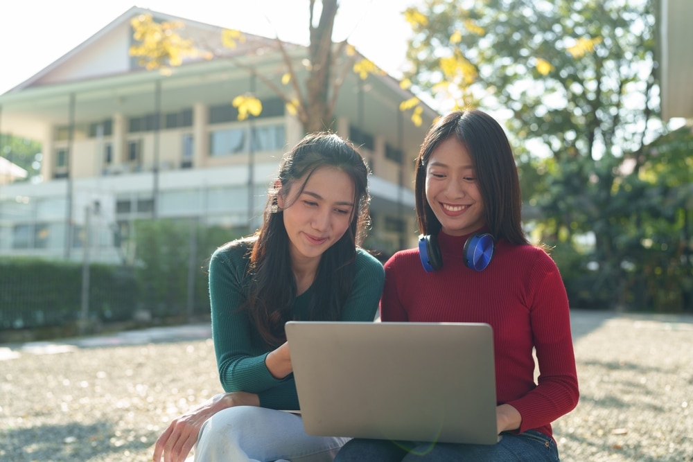 University Student Two Asian College Girls Enjoying Conversation Say Hello